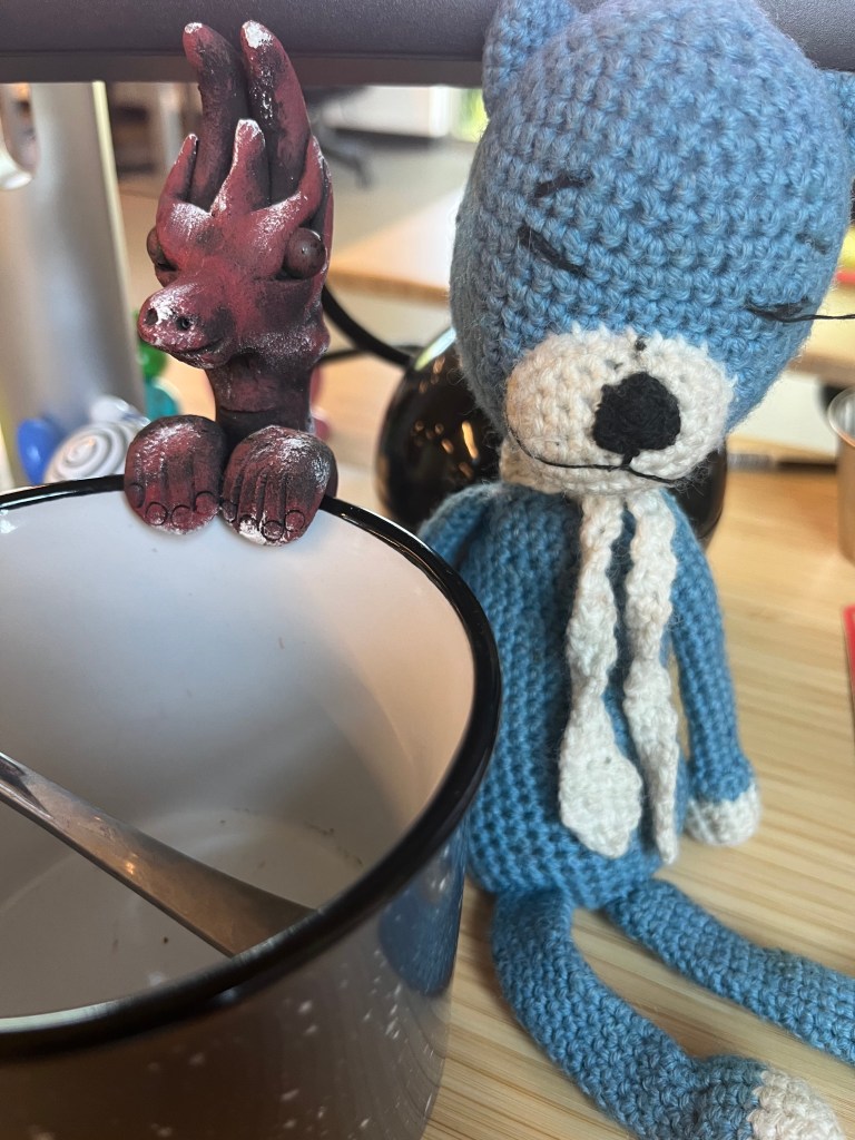 Blue Cat with his new wooden dragon friend